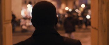 Movie still from “Simon Killer” (2012), directed by Antonio Campos – A blurry picture of a man's face at night; Close Up shot, Over the shoulder angle