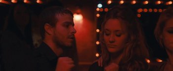 Movie still from “Simon Killer” (2012), directed by Antonio Campos – A man and a woman are looking at one another; Close Up shot, Over the shoulder angle