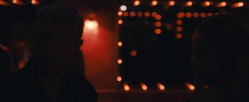 Movie still from “Simon Killer” (2012), directed by Antonio Campos – A person standing in front of a window at night; Close Up shot, Low angle