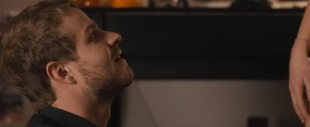 Movie still from “Simon Killer” (2012), directed by Antonio Campos – A person looking up at the sky; Close Up shot, Low angle