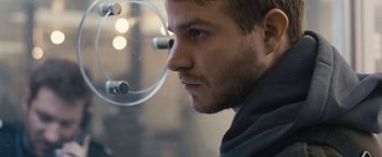 Movie still from “Simon Killer” (2012), directed by Antonio Campos – A man's face as he looks into a mirror; Close Up shot, Low angle