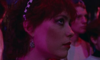 Movie still from “Smithereens” (1982), directed by Susan Seidelman – A person wearing a checkered headband; Close Up shot, Low angle
