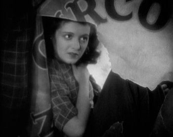 Movie still from “Street Angel” (1928), directed by Frank Borzage – A black - and - white photo of a woman in a hat; Close Up shot, Low angle