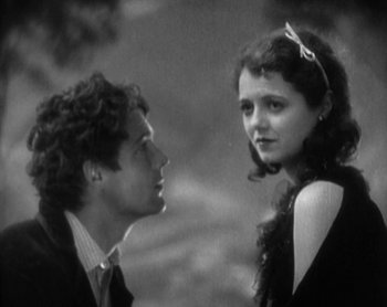 Movie still from “Street Angel” (1928), directed by Frank Borzage – A man and a woman looking at one another; Close Up shot, High angle