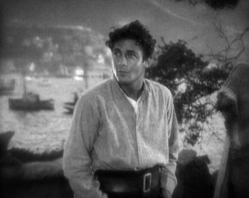 Movie still from “Street Angel” (1928), directed by Frank Borzage – A black and white photo of a man with a belt around his waist; Medium shot, High angle