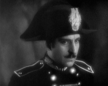Movie still from “Street Angel” (1928), directed by Frank Borzage – A black and white photo of a man in a military uniform; Close Up shot, Low angle