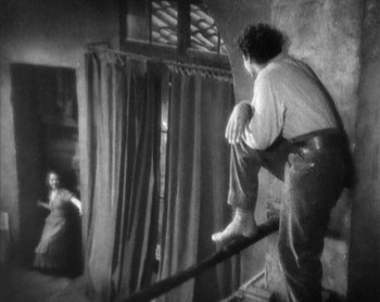 Movie still from “Street Angel” (1928), directed by Frank Borzage – A black and white photo of a man and a woman; Wide shot, Low angle
