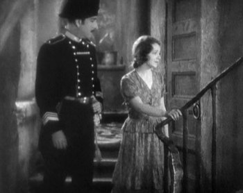 Movie still from “Street Angel” (1928), directed by Frank Borzage – A man and a woman standing next to a railing; Medium shot, High angle