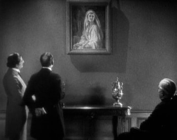 Movie still from “Street Angel” (1928), directed by Frank Borzage – A man and a woman standing in front of a painting; Medium shot, Low angle