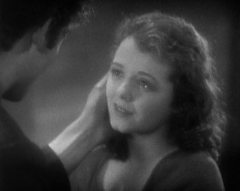Movie still from “Street Angel” (1928), directed by Frank Borzage – A young girl is getting her hair combed by an older man; Close Up shot, High angle