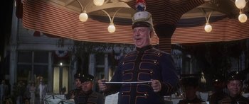 Movie still from “Summer and Smoke” (1961), directed by Peter Glenville – A man in a military uniform holding a sword; Medium shot, Low angle