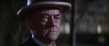Movie still from “Summer and Smoke” (1961), directed by Peter Glenville – An older man wearing a hat and a suit; Close Up shot, Low angle