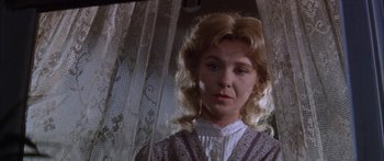 Movie still from “Summer and Smoke” (1961), directed by Peter Glenville – A person wearing a dress; Close Up shot, Low angle