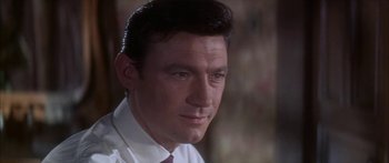 Movie still from “Summer and Smoke” (1961), directed by Peter Glenville – A person wearing a shirt and tie; Close Up shot, Low angle