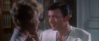 Movie still from “Summer and Smoke” (1961), directed by Peter Glenville – A man and a woman looking at one another; Close Up shot, Over the shoulder angle