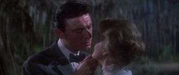 Movie still from “Summer and Smoke” (1961), directed by Peter Glenville – A man and a woman are looking into each others eyes; Close Up shot, Over the shoulder angle