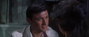 Movie still from “Summer and Smoke” (1961), directed by Peter Glenville – A person wearing a shirt and a tie; Close Up shot, Over the shoulder angle