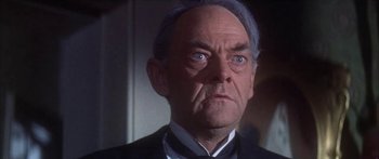 Movie still from “Summer and Smoke” (1961), directed by Peter Glenville – An older man in a suit and bow tie; Close Up shot, Low angle