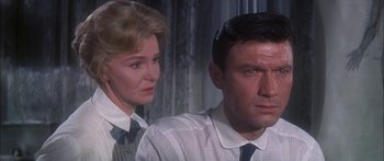 Movie still from “Summer and Smoke” (1961), directed by Peter Glenville – A man and a woman wearing ties in a room; Close Up shot, Low angle