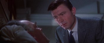 Movie still from “Summer and Smoke” (1961), directed by Peter Glenville – A person wearing a suit and tie; Close Up shot, Over the shoulder angle