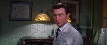 Movie still from “Summer and Smoke” (1961), directed by Peter Glenville – A person wearing a suit and tie; Close Up shot, Low angle