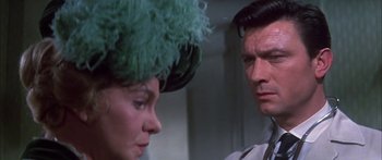 Movie still from “Summer and Smoke” (1961), directed by Peter Glenville – A man and a woman looking at one another; Close Up shot, Over the shoulder angle
