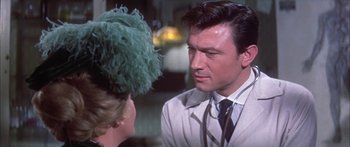 Movie still from “Summer and Smoke” (1961), directed by Peter Glenville – A man and a woman talking to each other; Close Up shot, Over the shoulder angle