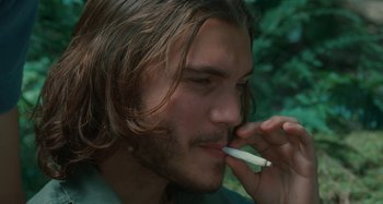 Movie still from “Taking Woodstock” (2009), directed by Ang Lee – A person smoking a cigarette; Close Up shot, Low angle