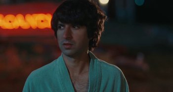 Movie still from “Taking Woodstock” (2009), directed by Ang Lee – A person wearing a shirt; Close Up shot, Over the shoulder angle