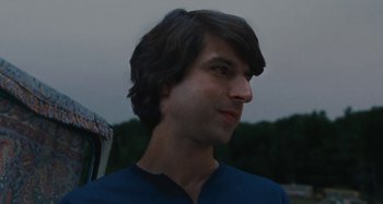 Movie still from “Taking Woodstock” (2009), directed by Ang Lee – A person wearing a blue shirt; Close Up shot, Low angle