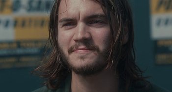 Movie still from “Taking Woodstock” (2009), directed by Ang Lee – A person with long hair and a beard; Close Up shot, Low angle
