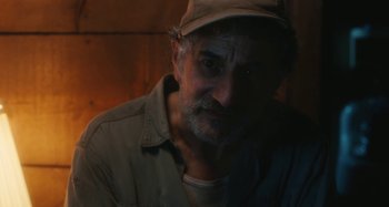 Movie still from “Taking Woodstock” (2009), directed by Ang Lee – A person wearing a hat; Close Up shot, Over the shoulder angle
