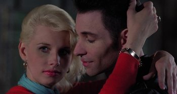 Movie still from “The Loveless” (1981), directed by Kathryn Bigelow – A man and a woman looking at each other; Close Up shot, Low angle