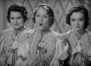 Movie still from “The Merry Widow” (1934), directed by Ernst Lubitsch – A woman with three different expressions on her face; Close Up shot, High angle