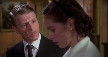 Movie still from “The Mirror Crack'd” (1980), directed by Guy Hamilton – A man and a woman looking at one another; Close Up shot, Over the shoulder angle