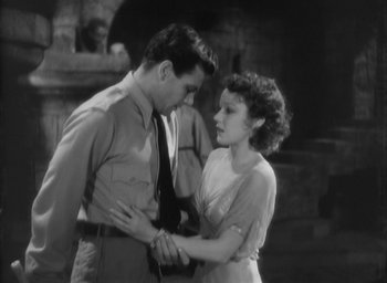 Movie still from “The Most Dangerous Game” (1932), directed by Irving Pichel – A man and a woman standing next to each other; Medium shot, High angle