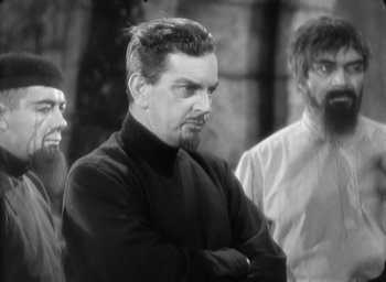 Movie still from “The Most Dangerous Game” (1932), directed by Irving Pichel – A black and white photo of a man with a beard; Medium shot, Over the shoulder angle