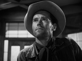 Movie still from “The Ox-Bow Incident” (1942), directed by William A. Wellman – Black and white photograph of a man wearing a cowboy hat; Close Up shot, Low angle
