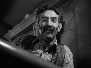 Movie still from “The Ox-Bow Incident” (1942), directed by William A. Wellman – An older man with a mustache and a mustache comb; Close Up shot, Low angle