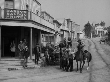Movie still from “The Ox-Bow Incident” (1942), directed by William A. Wellman – A black and white photo of people on horses; Wide shot, High angle