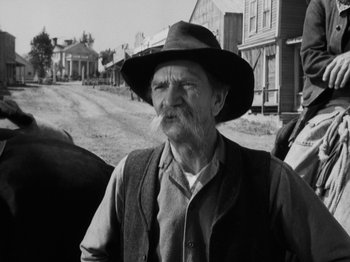 Movie still from “The Ox-Bow Incident” (1942), directed by William A. Wellman – An old man with a beard wearing a cowboy hat; Close Up shot, Low angle
