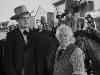Movie still from “The Ox-Bow Incident” (1942), directed by William A. Wellman – A black and white photo of a man and a woman; Medium shot, Low angle