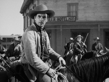 Movie still from “The Ox-Bow Incident” (1942), directed by William A. Wellman – A black and white photo of a man on a horse; Medium shot, Low angle