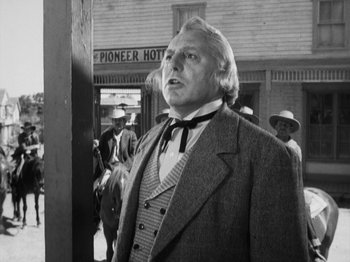 Movie still from “The Ox-Bow Incident” (1942), directed by William A. Wellman – A man standing in front of a group of people; Medium shot, Low angle