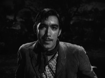 Movie still from “The Ox-Bow Incident” (1942), directed by William A. Wellman – A black and white photo of a man with a mustache; Close Up shot, Low angle