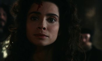 Movie still from “The Pit and the Pendulum” (1991), directed by Stuart Gordon – A person with a cross on their forehead; Close Up shot, High angle