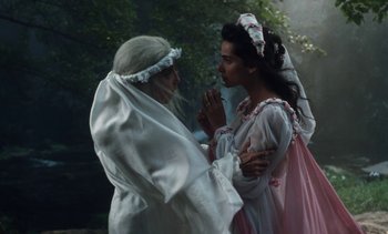 Movie still from “The Pit and the Pendulum” (1991), directed by Stuart Gordon – Two women dressed up in medieval clothing talking to each other; Medium shot, Over the shoulder angle