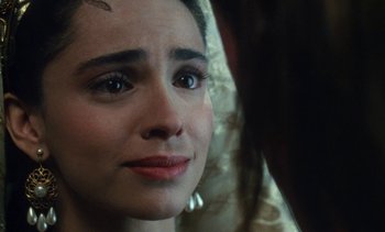 Movie still from “The Pit and the Pendulum” (1991), directed by Stuart Gordon – A person looking at a mirror; Close Up shot, Over the shoulder angle