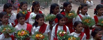 Movie still from “The Rains of Ranchipur” (1955), directed by Jean Negulesco – A group of young girls holding bunches of flowers; Close Up shot, High angle