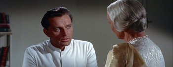 Movie still from “The Rains of Ranchipur” (1955), directed by Jean Negulesco – A man and a woman talking to each other; Close Up shot, Over the shoulder angle